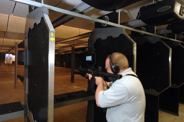 Police officer training at indoor firing range